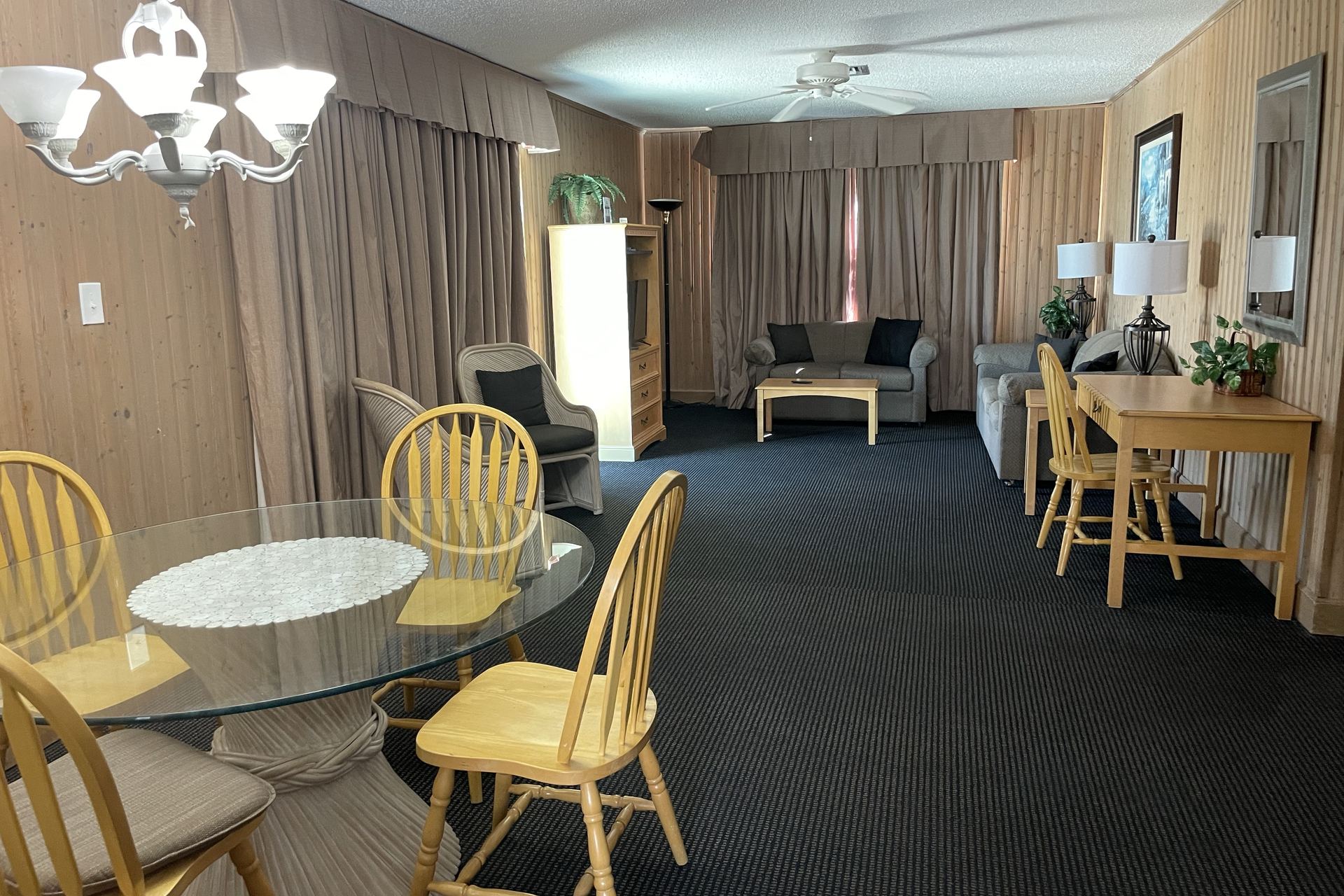 Penthouse dining table for six with the living area beyond